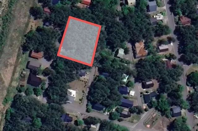 Aerial view of our Kamishiro land with the plot boundary outlined in red, among forest and holiday homes