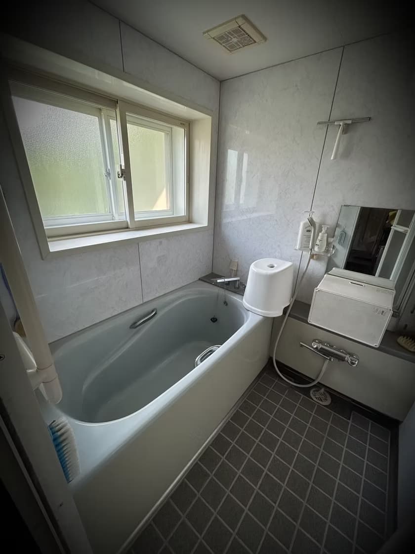 Bathroom with unit bath and sink