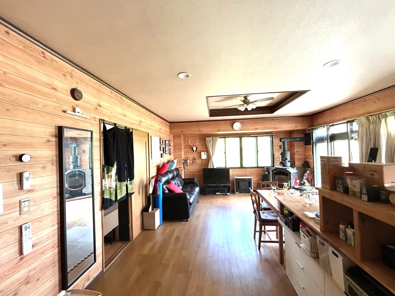 Open living and dining space with wood interior