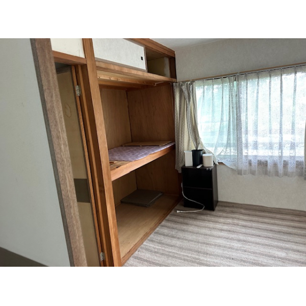 Room with built-in desk and storage