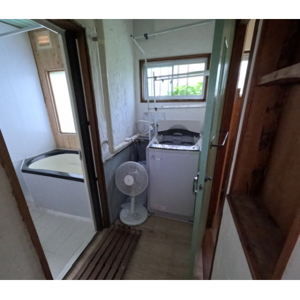 Washing area with small sink and natural light
